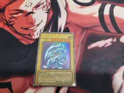 Blue-Eyes White Dragon SDK-001 - YuGiOh Card - DMG - Image 1