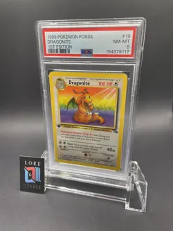 1999 POKEMON FOSSIL 1ST EDITION #19 DRAGONITE PSA 8 - Image 1