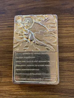 Nintendo Pokemon 1999 Limited Edition Charizard Metal Card 24K Gold Plated - Image 1