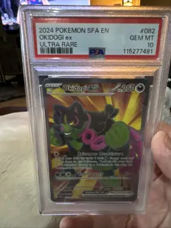 2024 Pokemon SFA EN Okidogi ex #082 – Ultra Rare – PSA 10 GEM MT - Image 1