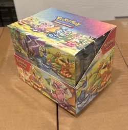 Pokemon Prismatic Evolutions Mini Tin Display Box (8 Mini Tins) - FACTORY SEALED - Image 1