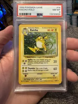 1999 POKEMON BASE SET UNLIMITED #14 RAICHU-HOLO PSA 8 - Image 1