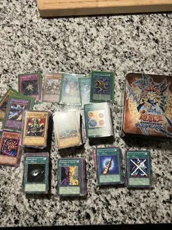 YU-GI-OH! RANDOM LOT OF CARDS- FIRST EDITIONS/ VINTAGE AND MODERN PLUS TIN BOX - Image 1