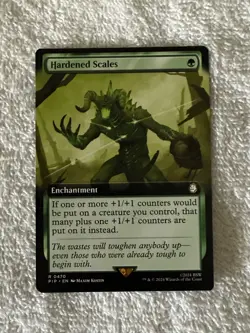 MTG: Fallout #R0470 Hardened Scales Extended Art Near Mint Unplayed - Image 1