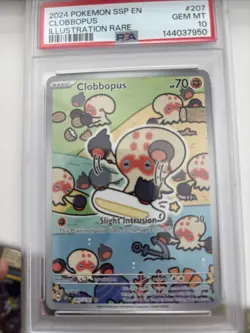 Pokemon GRADED 2024 Clobbopus 207 IR Illustration Surging Sparks PSA 10 English - Image 1