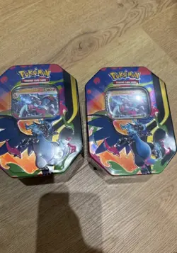 Pokemon TCG Mega Charizard X Tins. BOTH TINS. Brand New & Sealed in hand - Image 1