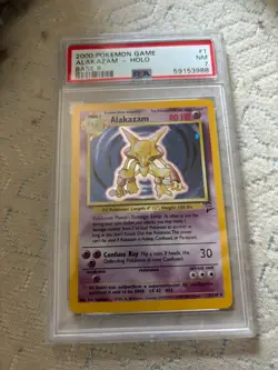 2000 POKEMON BASE SET 2 #1 ALAKAZAM-HOLO PSA 7 - Image 1
