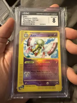 2003 POKEMON SKYRIDGE #35 XATU-REVERSE FOIL CGC 8 - Image 1