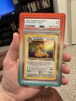 Pokemon Dragonite Holo PSA 7 Fossil 1999 #4 4/62 - Image 1