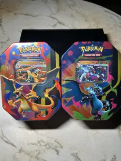 Pokemon TCG Mega Charizard Y EX & Mega Charizard X EX Tins - Lot Of 2 In Hand - Image 1
