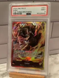 One Piece Card Game The Three Brothers ST13-001 Sabo Leader English - PSA 9 - Image 1