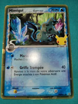 Carte Pokemon Mimiqui Especes Delta Promo SWSH136 Celebrations 25 Ans FR - Image 1