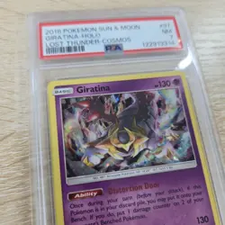 RARE COSMOS PSA 7 NM Giratina 97/214 Sun & Moon Lost Thunder Holo Pokemon Card - Image 1