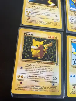 Pokemon Card LOT Flying Pikachu WOTC Black Star Promo surfing 25, 28, 4, and 1 - Image 4