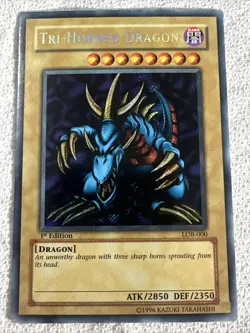 MINT** Yu-Gi-Oh! TCG Tri-Horned Dragon LOB-000 1st Edition Secret Rare - Image 1