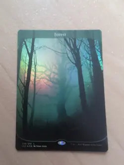 Forest (216) Unstable - Lightly Played Foil - Image 1