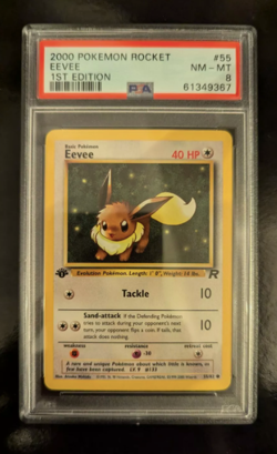 PSA 8 NM - MINT 2000 1ST EDITION ROCKET POKEMON EEVEE 55/82 #55 WOTC GRADED - Image 1