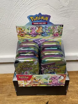 Pokemon TCG Prismatic Evolutions Full Set of 8 Sealed Mini Tins With Display - Image 1