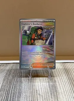 Explorer’s Guidance 107/131 Poke Ball Pattern Prismatic Evolutions Pokemon Card - Image 1