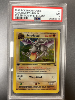 1999 POKEMON FOSSIL 1ST ED-PRERELEASE #1 AERODACTYL-HOLO PSA 7 - Image 1