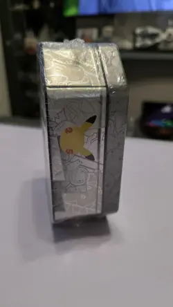 Pokemon TCG 25th Celebrations Lance's Charizard Tin factory sealed - Image 5