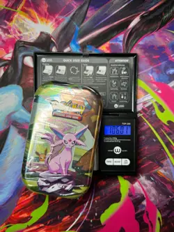 (VERY HEAVY)🔥 106.01g Pokemon Prismatic Evolutions Mini Tin Brand New Sealed - Image 1