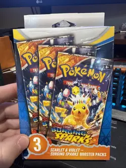 Pokemon TCG Scarlet and Violet Surging Sparks Booster Pack Sealed, 3-Pack - Image 1