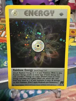 Rainbow Energy 1st Edition Team Rocket Holo #17/82 English Pokemon Card - Image 1