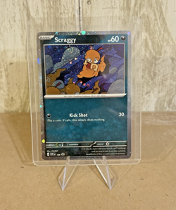 Scraggy Cosmos Holo SWIRL! Scarlet & Violet Black Star Promo 186 Pokemon TCG - Image 1