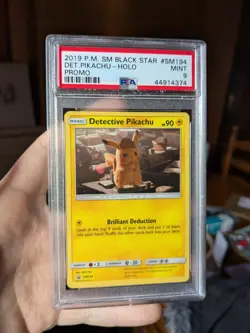 PSA 9 Detective Pikachu Cosmos Holo Black Star Promo #SM194 Pokemon Card 2019 - Image 1