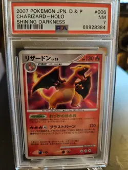 2007 Pokemon Japanese Shining Darkness 006 Charizard Holo PSA 7 - Image 1