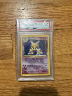Wizards of the Coast 1999 Pokemon Base Set 2 Alakazam Holo #1 PSA 8 - Image 1