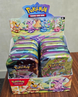 Pokemon Prismatic Evolutions Mini Tin Factory Sealed with Two Packs of Cards - Image 1