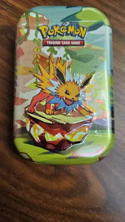 Pokemon Prismatic Evolutions Mini Tin Factory Sealed with Two Packs of Cards - Image 3