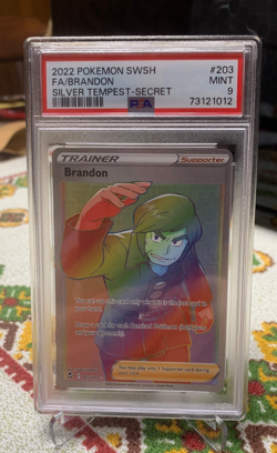 Brandon - 203/195 - Secret Rare - Silver Tempest - Pokemon Card - MINT PSA 9 - Image 1