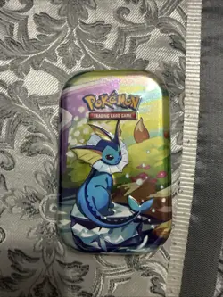 Pokemon TCG - Prismatic Evolutions Mini Tin (Vaporeon) Factory Sealed - Image 1