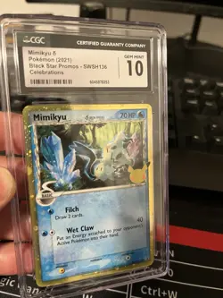 Pokemon TCG Mimikyu SWSH136 Delta Species Celebrations Black Star Promo Holo - Image 2