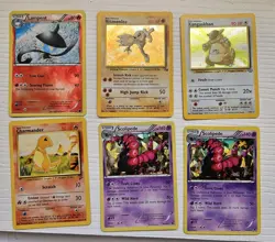 100+ Assorted Pokemon Trading Cards with Binder - Image 1