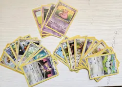 100+ Assorted Pokemon Trading Cards with Binder - Image 4