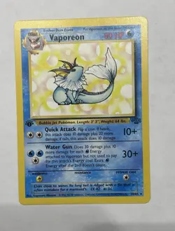 Vaporeon First Edition 12/64 Jungle Holo Rare Pokemon Card WOTC 1999 - Image 1