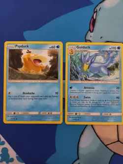 Psyduck 26/181 + Golduck 27/181 - Pokemon Team Up, English - Image 1