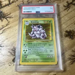 1999 POKEMON GAME #11 NIDOKING-HOLO PSA 7 - Image 1