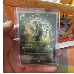 Ravensburger Disney Lorcana TCG Milo Thatch Getting His Hands Dirty Emerald Foil - Image 1
