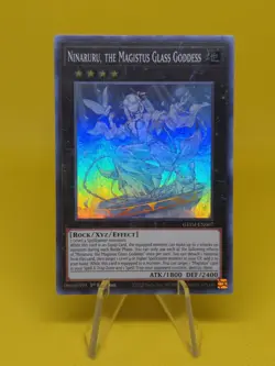 Yugioh - Ninaruru, the Magistus Glass Goddess (GEIM-EN007) - Super Rare 1st Ed - Image 1