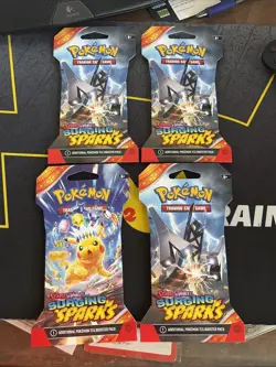 Pokemon TCG Surging Sparks Sleeved pokemon Booster Packs Sealed Lot Of 4. - Image 1