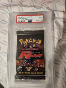 PSA 9 Pokemon TCG WOTC 2000 Team Rocket 1st Edition Booster Pack heavy - Image 1