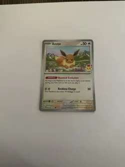 074/131 Eevee Prismatic Evolutions Stamped Promo Card - Pokemon Day 2025 - Image 1