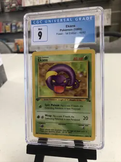 J4 Ekans #46 Fossil 1st Edition - Non Holo (CGC 9 Mint) - Pokemon - Image 1