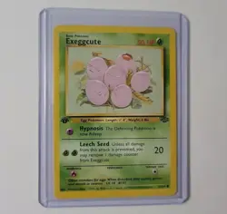 Exeggcute 52/64 1st Edition Jungle Vintage WOTC Pokemon Card LP-NM - Image 1