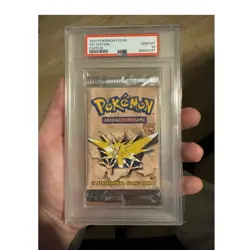 1999 Pokemon Fossil 1st Edition Zapdos Booster Pack PSA 10 English Cert 98944147 - Image 1